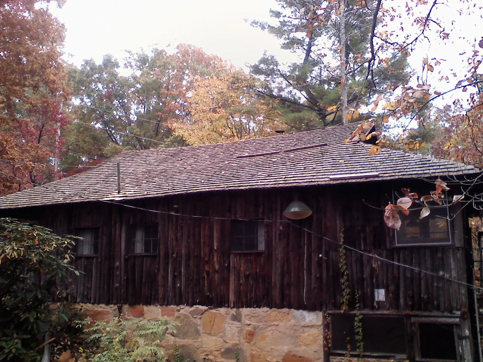 Weathered wood shake roof on a rustic board sided cabin in Honolulu